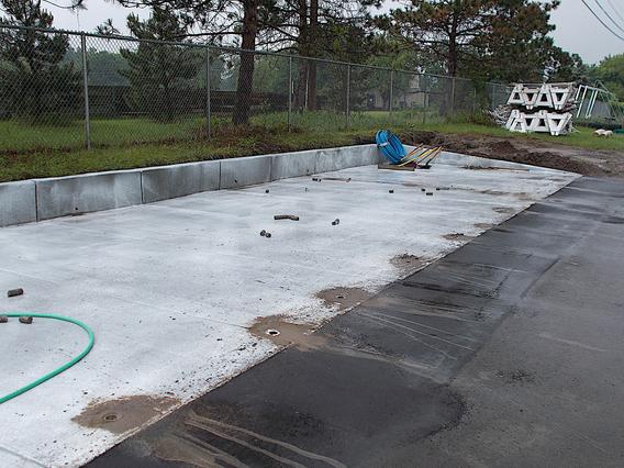 Concrete pad for the gravel bed